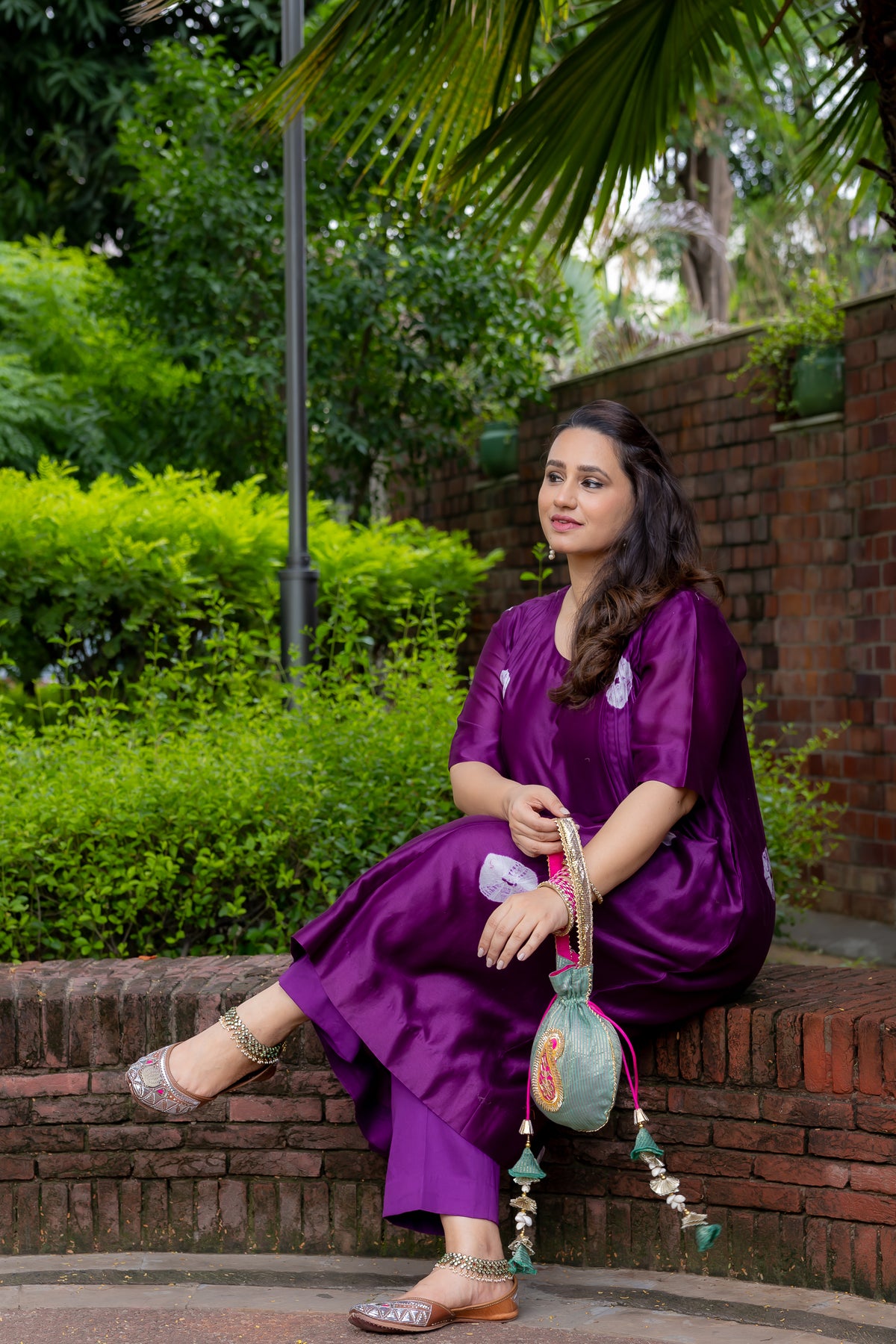 Model sitting view in Meghna A Line Kurta set.