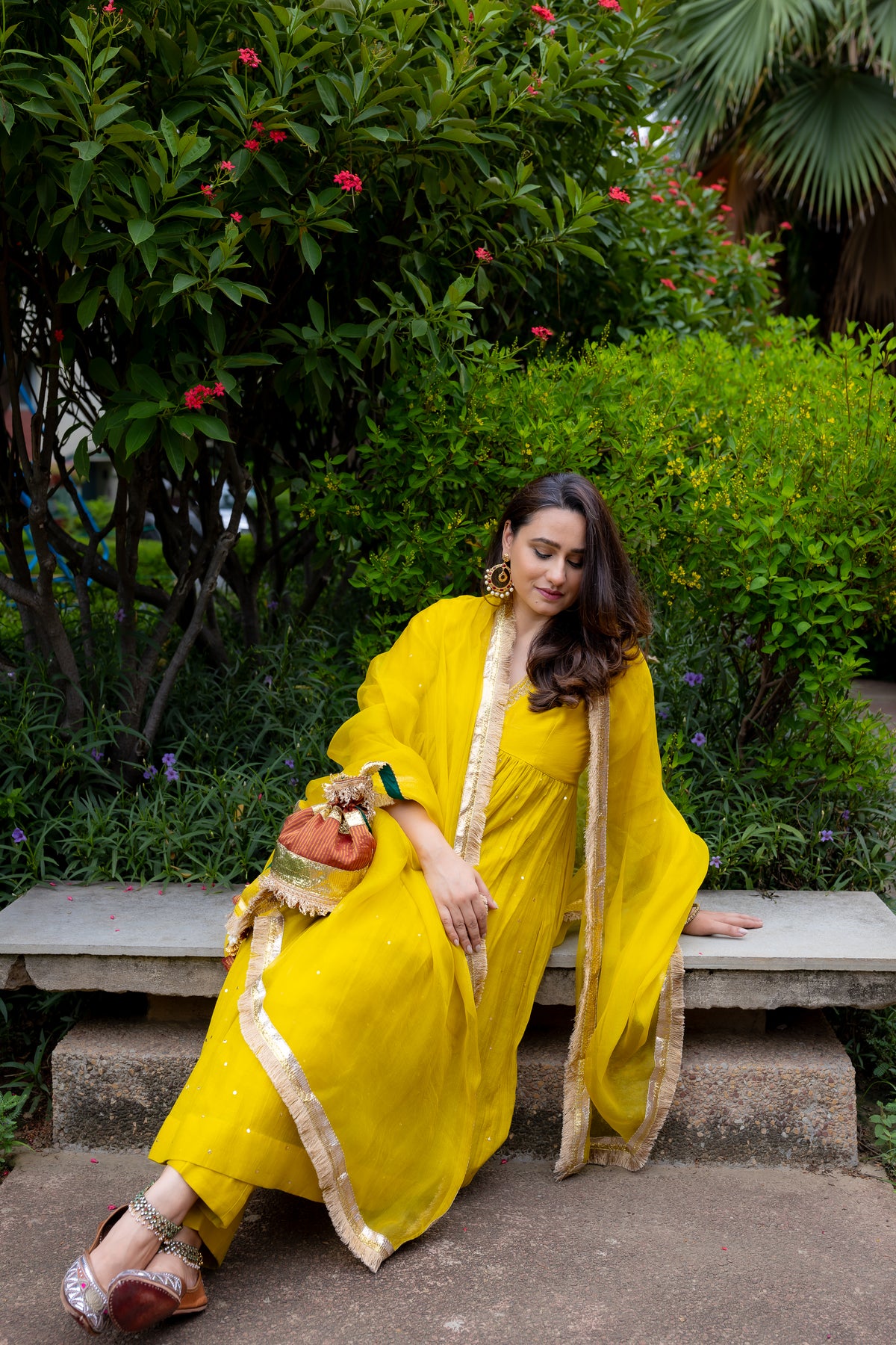 Model sitting view in Soniya Mul suit set