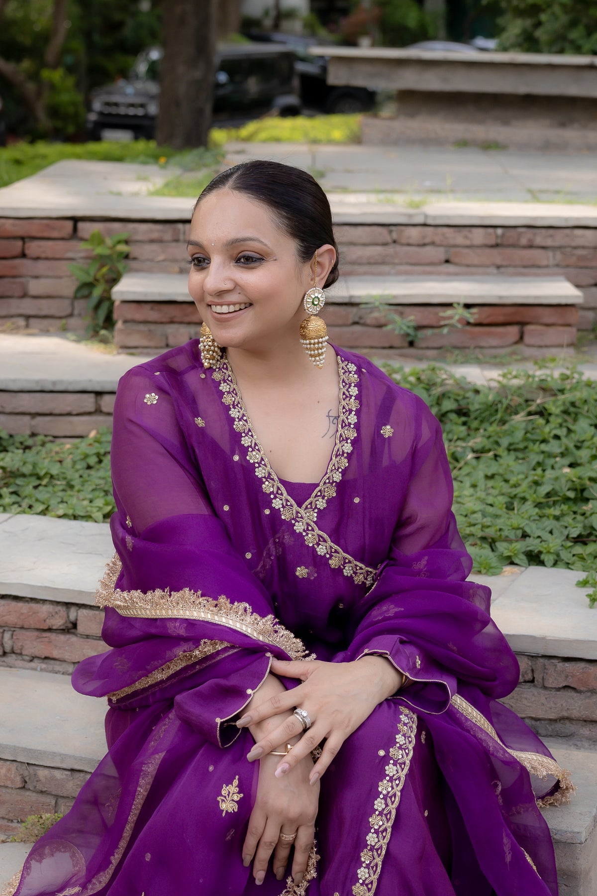 Model sitting view of Poorvi Angrakha Anarkali Set.