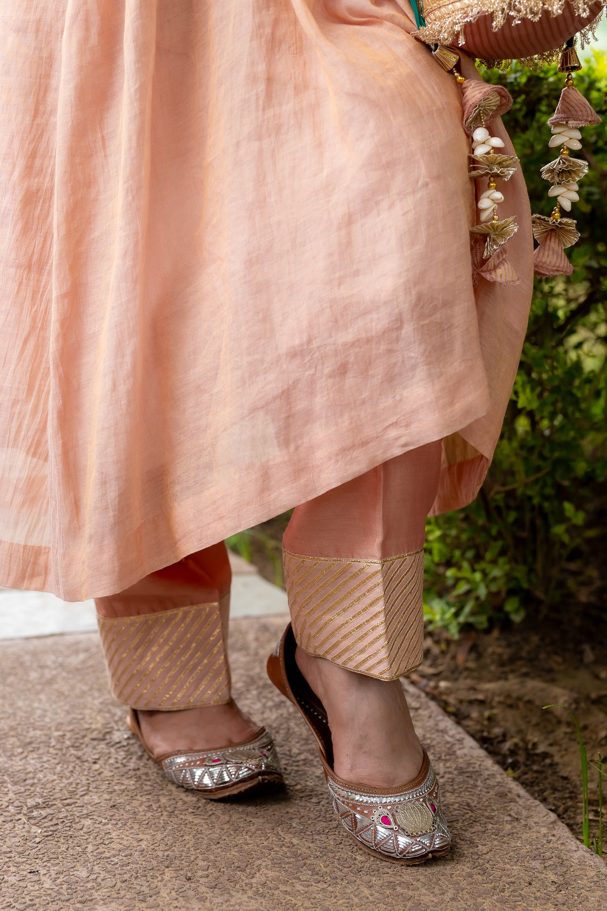 Bottom view of model posing in Madhu Tissue Pocket Dabka set.