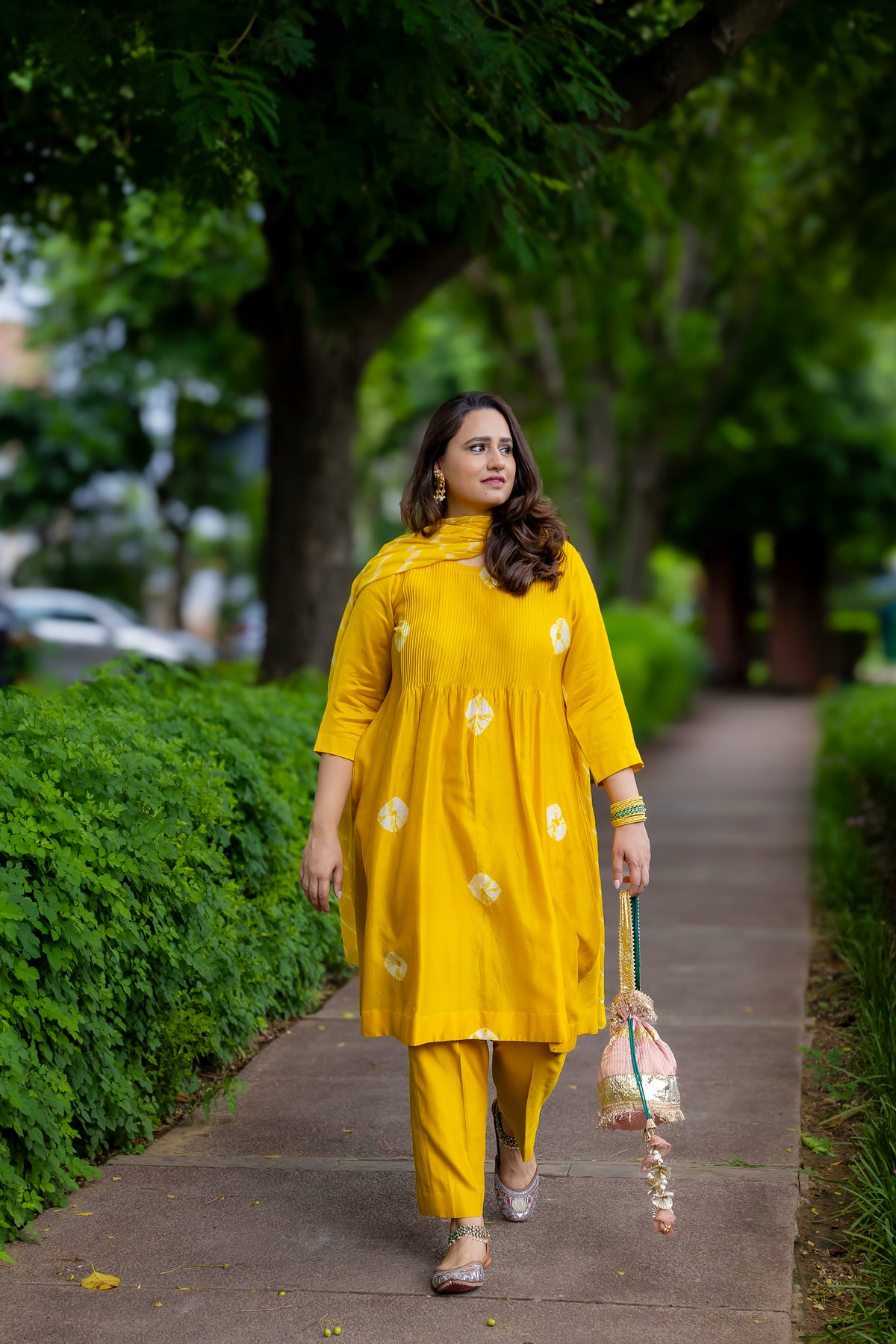 Front full length view of yellow Bandhej kurta set