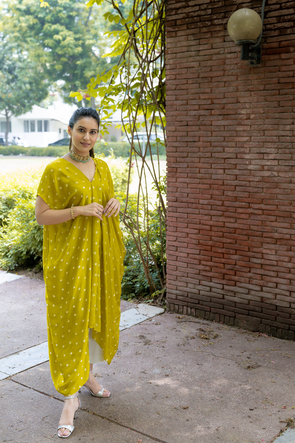 front view of Noor Bandhani yellow Kaftan Set.