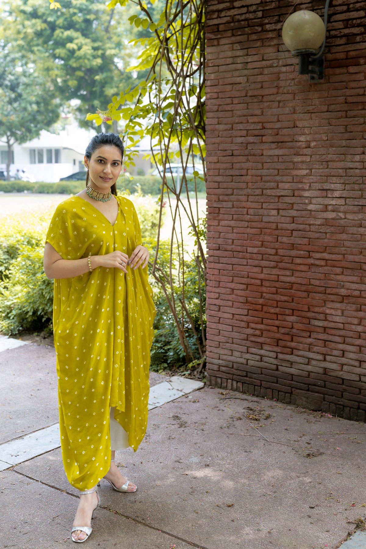 front view of Noor Bandhani yellow Kaftan Set.