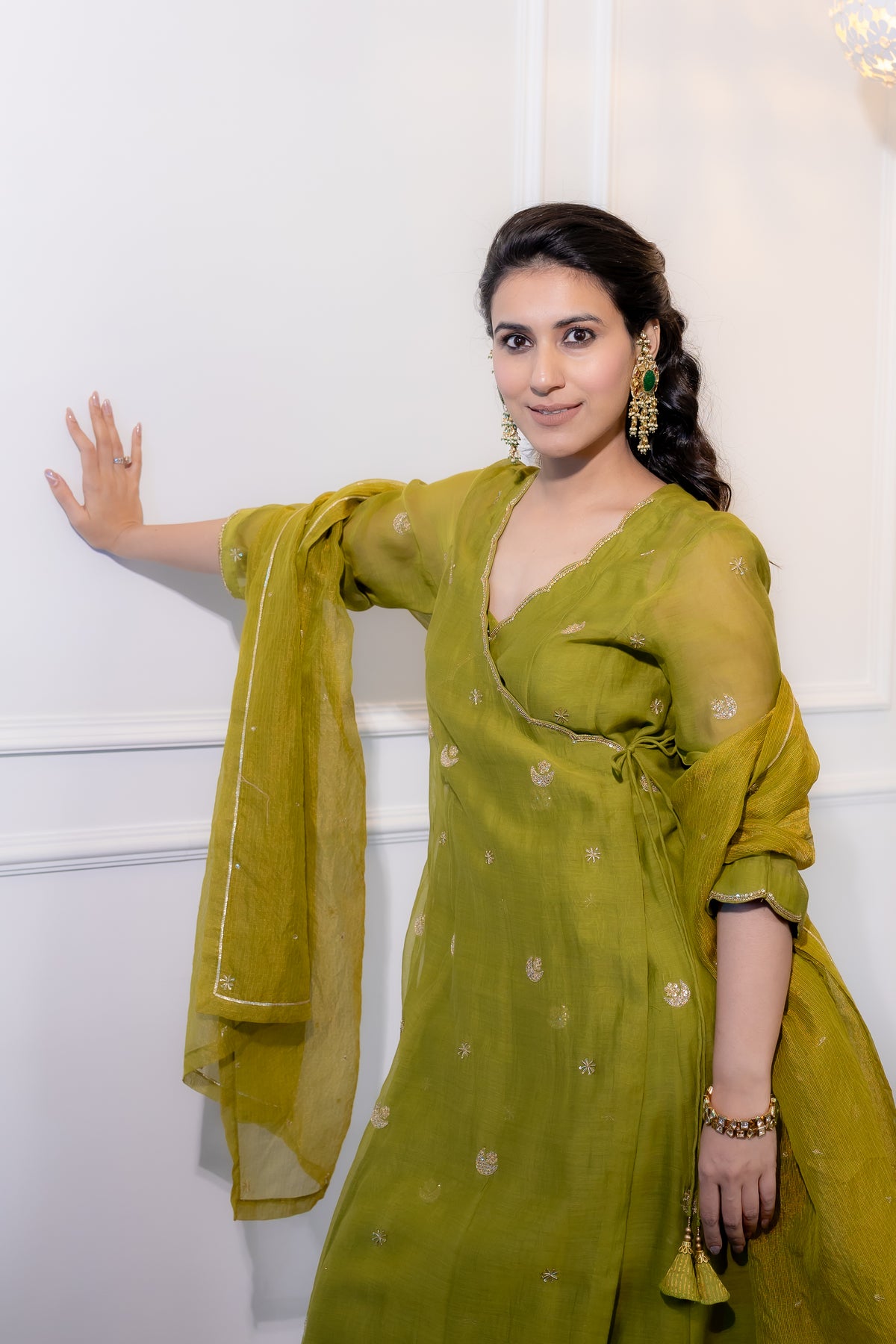 left view model pose of Saaz Olive Festive Suit Set.