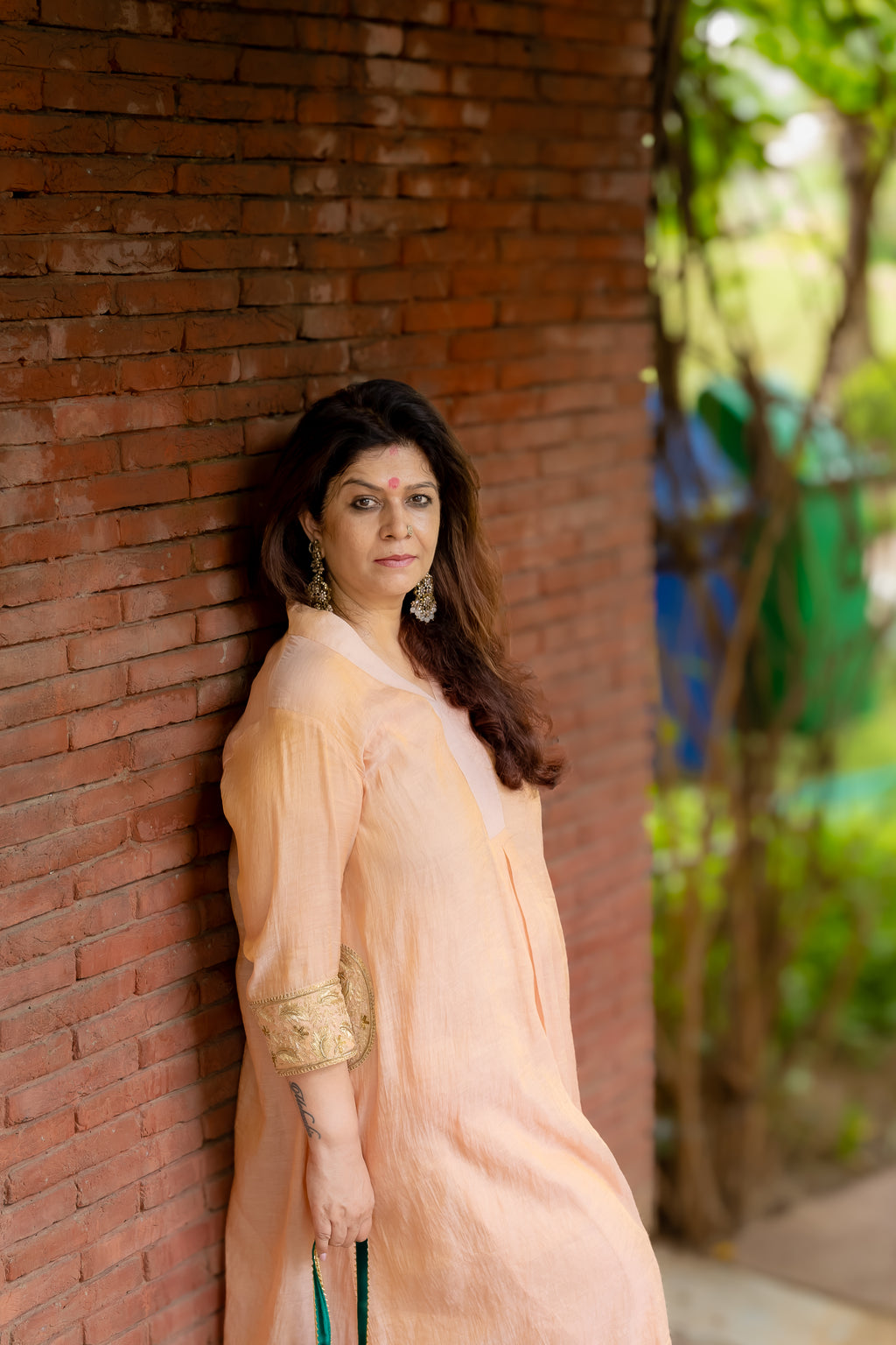 Model posing in Madhu Tissue Pocket Dabka set.