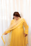 Model pose in Sunehri Anarkali Set.
