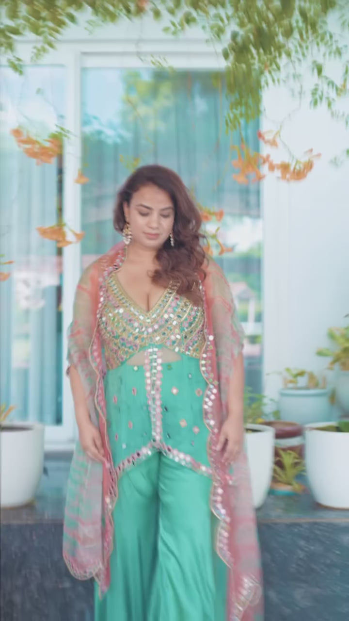 close up view of model in of Mint Bloom Mirror Work Sharara Set video.