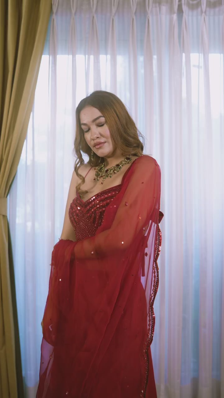 Model posing in pooja knotted sheesha blouse skirt set video.

