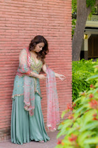 Right full view of model in of Mint Bloom Mirror Work Sharara Set.