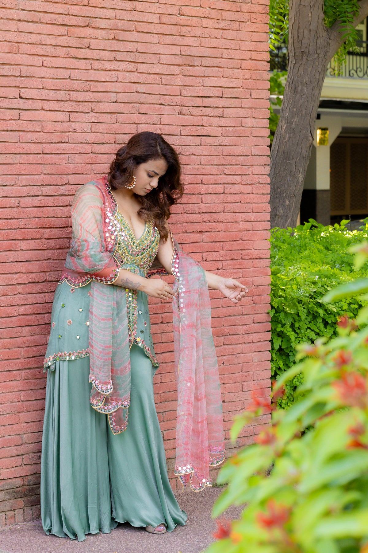Right full view of model in of Mint Bloom Mirror Work Sharara Set.