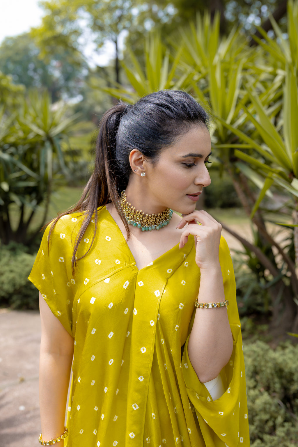 right view of Noor Bandhani yellow Kaftan Set.