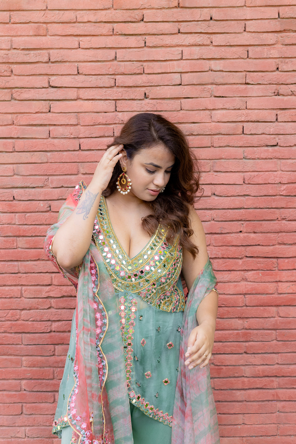 Close up view of model in of Mint Bloom Mirror Work Sharara Set.
