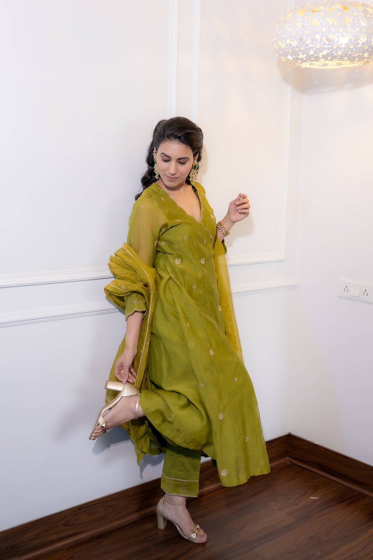 side full view of Saaz Olive Festive Suit Set.