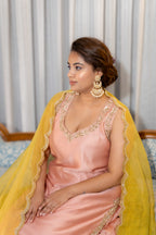 Sitting close up view of Gulnaar Peach Kurta Set with Mustard Dupatta.