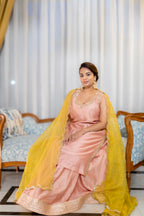Sitting view of Gulnaar Peach Kurta Set with Mustard Dupatta.